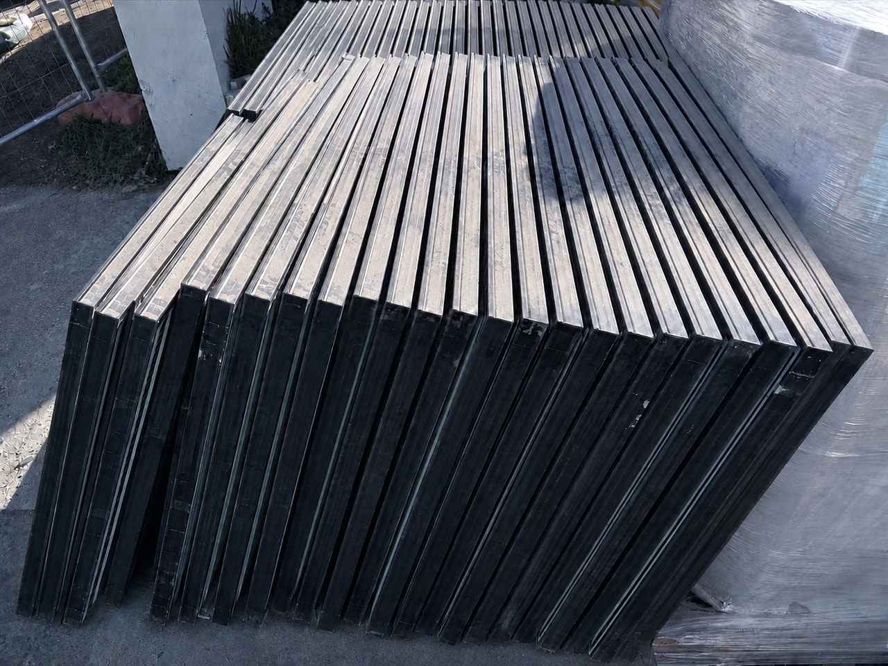 Removed solar panels stacked and documented for collection instead of landfill